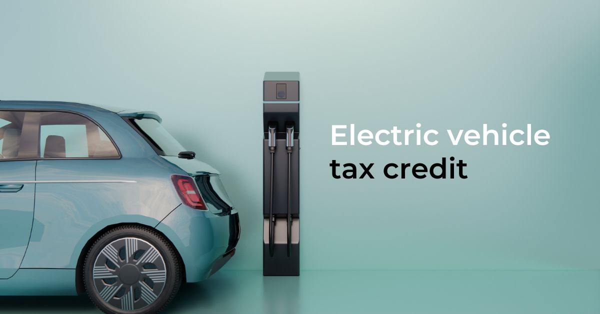 Electric vehicle backed up to a charging station